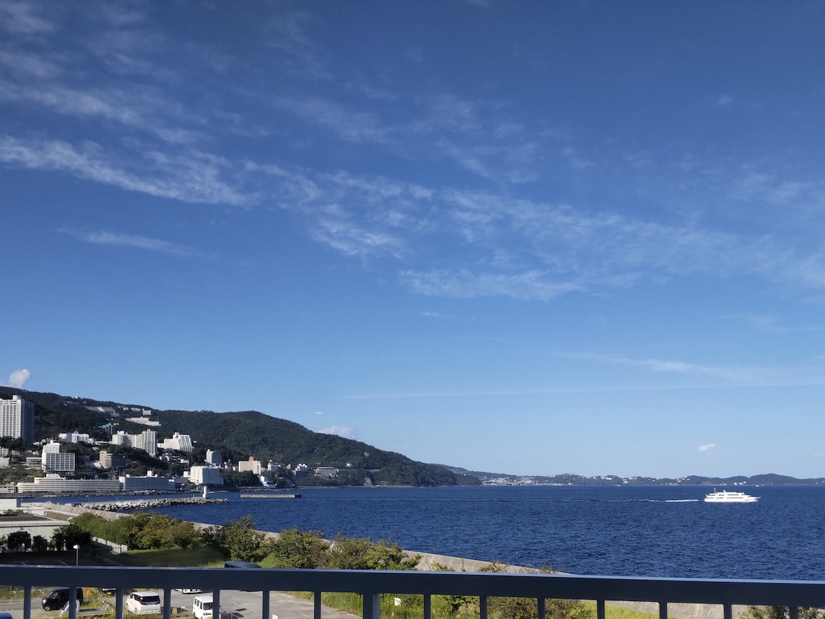 A clear white ferry boat on the sea under a blue sky