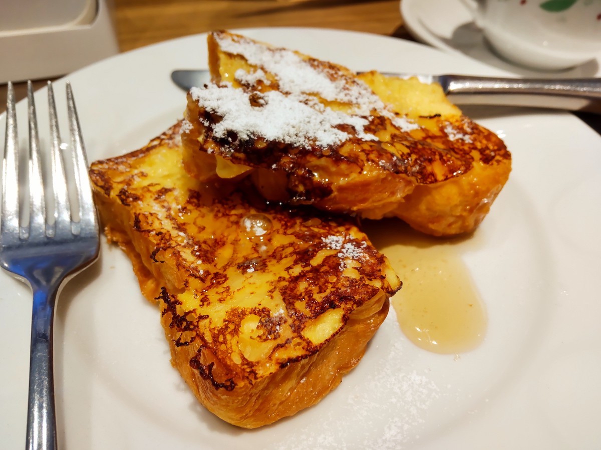 Danish french toast with golden brown crust drizzled with sweet maple syrup