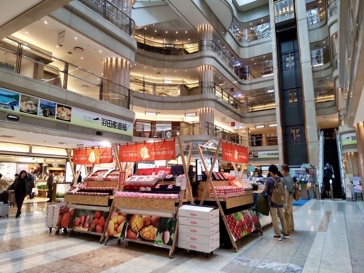 A five-story open atrium filled with multiple pop-up shops and market stalls