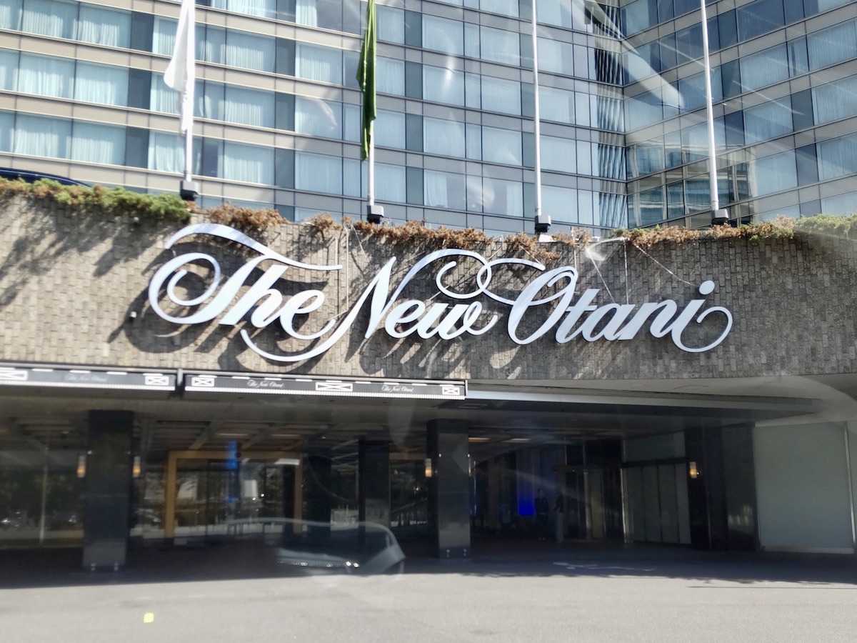 A building facade featuring a large Hotel New Otani sign