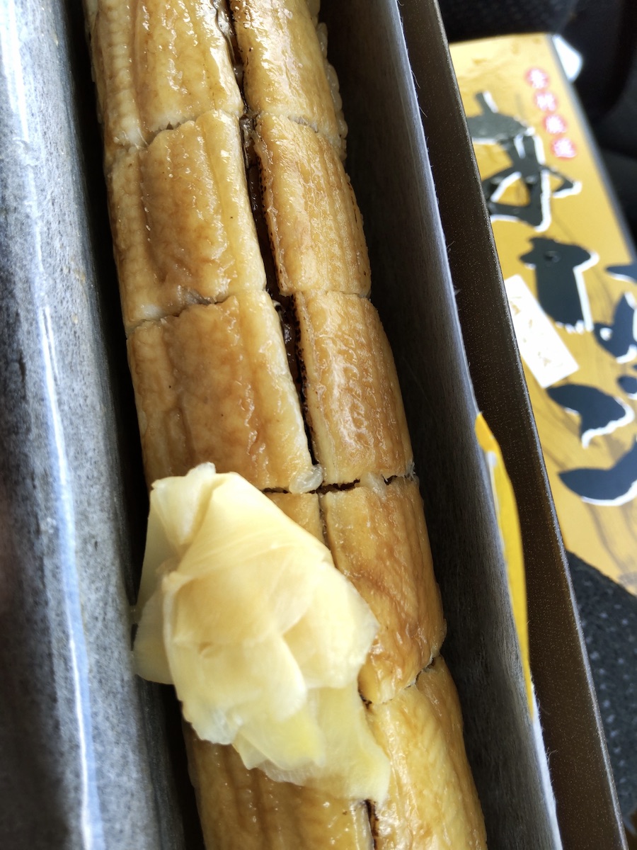 Japanese sea eel sushi roll neatly packed in a bento box