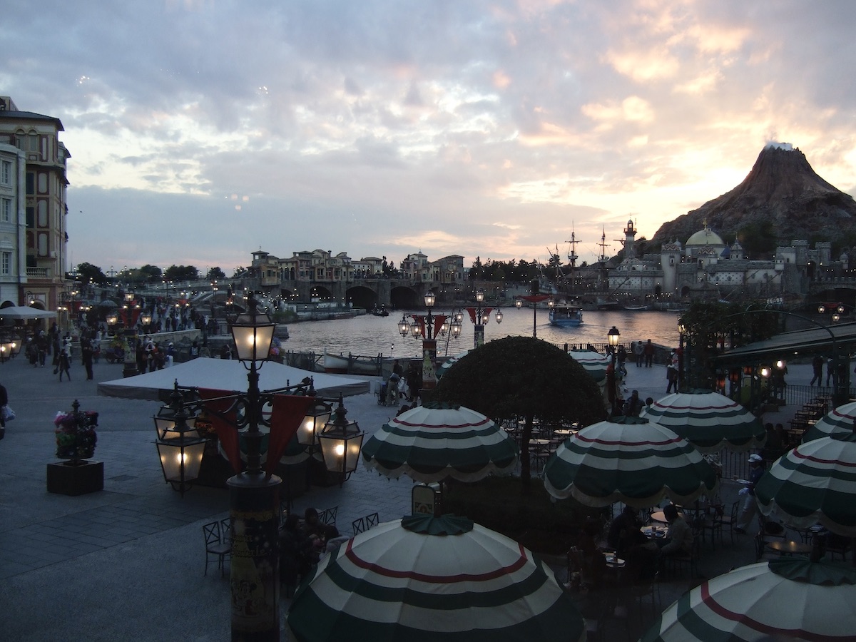 Scenic sunset view over Mediterranean Harbor and Mount Prometheus at Tokyo DisneySea