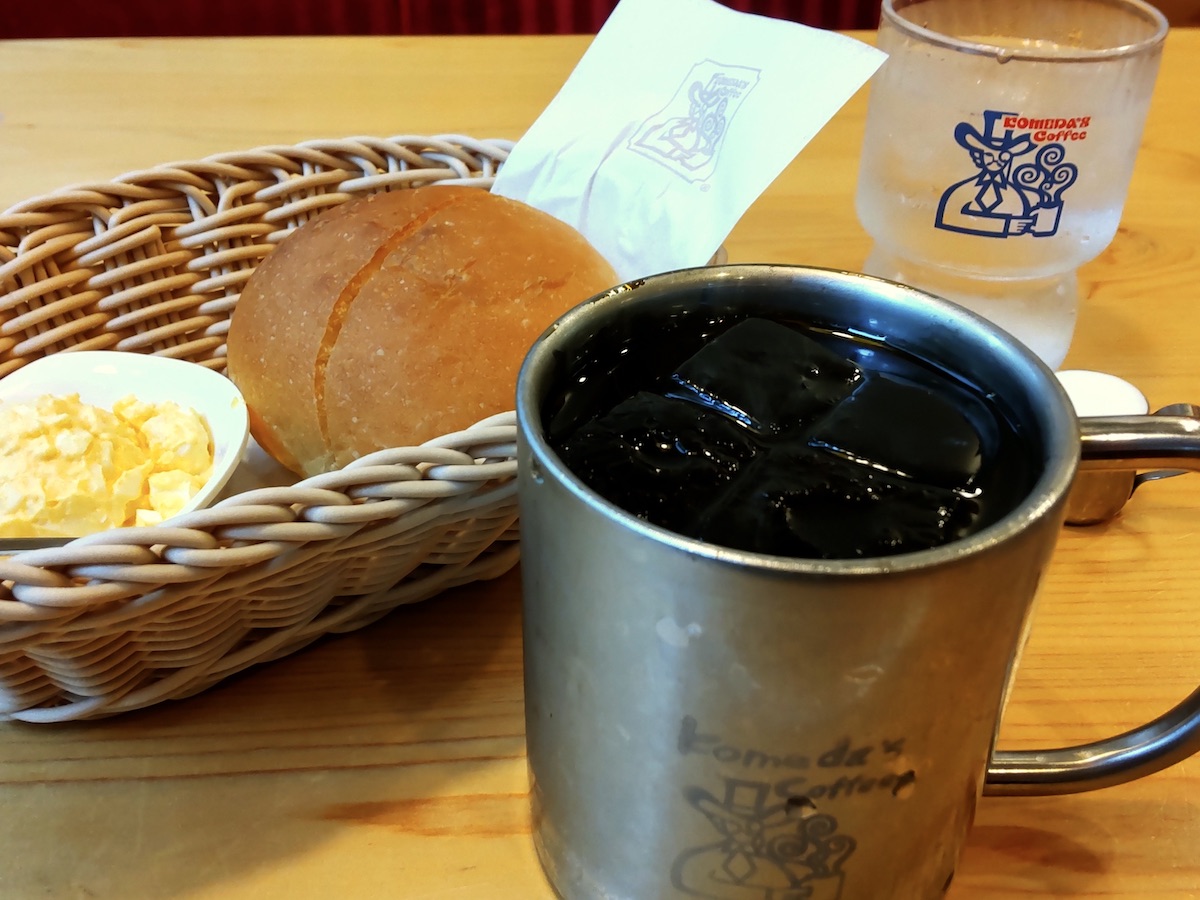 Japanese coffee shop morning set with iced coffee, warm bread, and egg