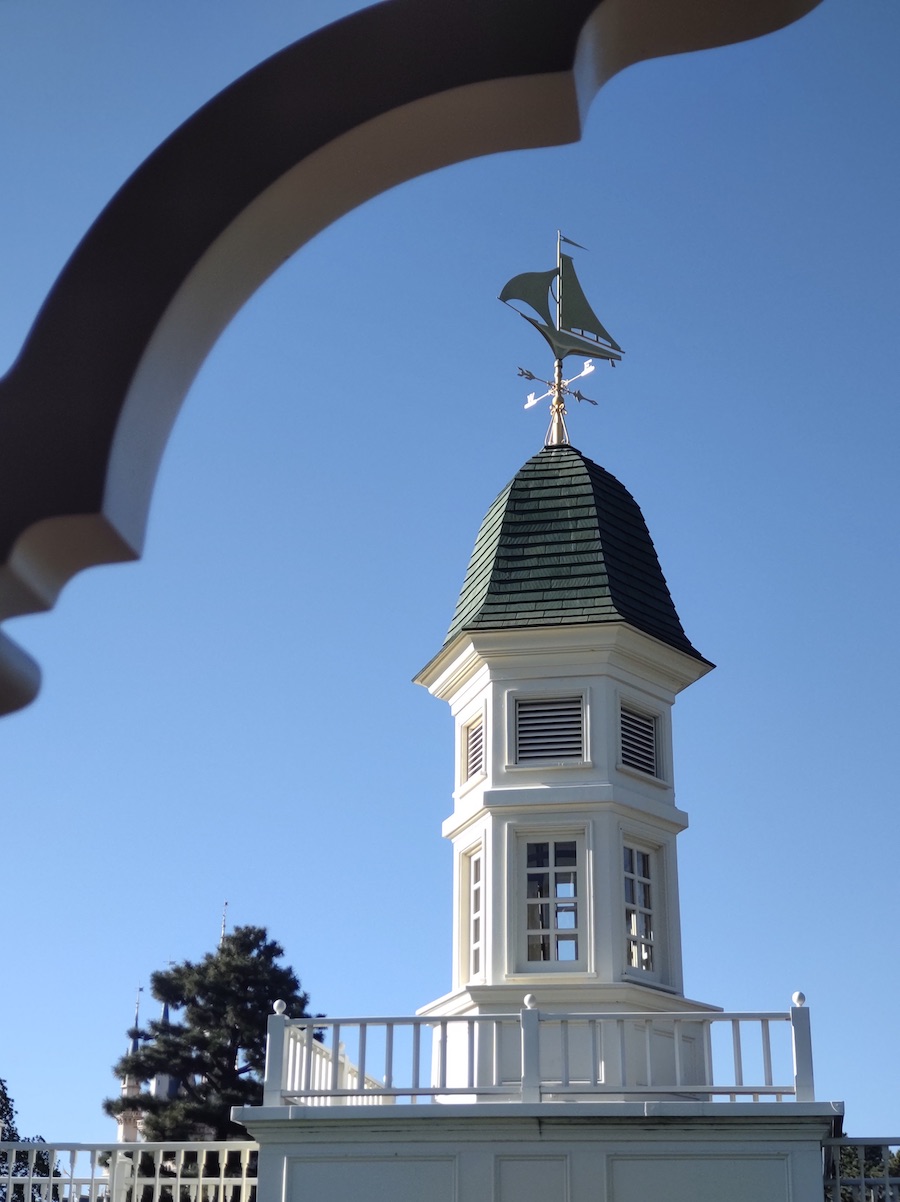 White cupola of the Mark Twain Riverboat landing topped with a ship weather vane